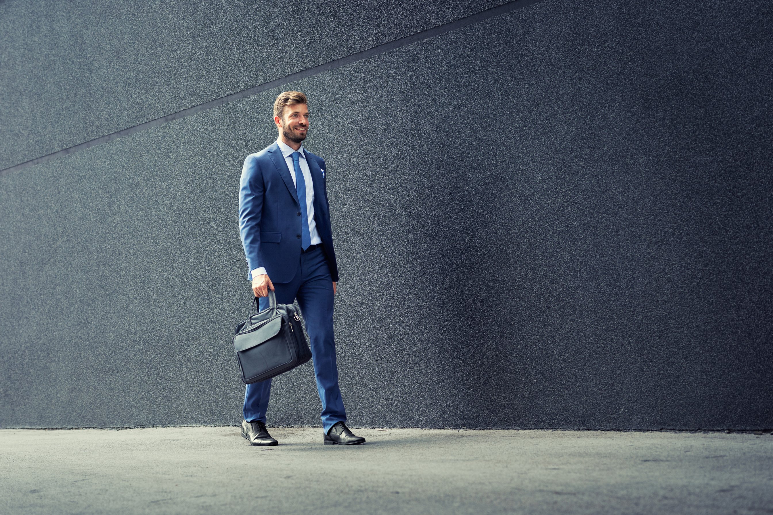 Walking business man with briefcase.